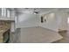 Spacious living room with stone fireplace, plush carpet, and a ceiling fan at 1453 Doggett Ave, Las Vegas, NV 89123