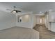 Open-concept living room with a ceiling fan, view of other rooms, and wood-look floors at 1453 Doggett Ave, Las Vegas, NV 89123