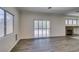 Living room with stylish flooring, natural light, and fireplace at 1453 Doggett Ave, Las Vegas, NV 89123