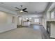 Open-concept living room with a fireplace and a view of kitchen with bar seating at 1453 Doggett Ave, Las Vegas, NV 89123