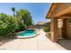 Backyard featuring a pool, mature trees, and patio area, offering an ideal setting for relaxation and outdoor enjoyment at 1453 Doggett Ave, Las Vegas, NV 89123