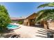 A serene backyard featuring a pool, mature landscaping, and patio space, perfect for outdoor entertaining and relaxation at 1453 Doggett Ave, Las Vegas, NV 89123