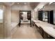 Spacious bathroom with double vanity, tub, and doorway to the main bedroom at 15 Golden Sunray Ln, Las Vegas, NV 89135