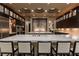 Spacious kitchen with a large island, modern appliances, and stylish lighting fixtures at 15 Golden Sunray Ln, Las Vegas, NV 89135