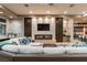 Cozy living room featuring a modern fireplace, built-in shelving, and comfortable seating at 15 Golden Sunray Ln, Las Vegas, NV 89135