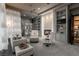 Stylish living room with modern fireplace, custom shelving, and comfortable seating at 15 Golden Sunray Ln, Las Vegas, NV 89135