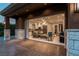 Open-concept living space with kitchen and sitting area, seamlessly connected to the outdoor patio at 15 Golden Sunray Ln, Las Vegas, NV 89135