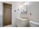 Traditional bathroom featuring a vanity, toilet, shower with neutral tile, and standard lighting at 1716 Luning Dr, Las Vegas, NV 89106