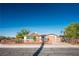 Charming single-story home with a well-maintained yard, gated entrance, and attached one-car garage at 1716 Luning Dr, Las Vegas, NV 89106