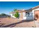 Charming single-story home with a well-maintained yard, gated entrance, and attached one-car garage at 1716 Luning Dr, Las Vegas, NV 89106