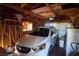 Garage with a white car, overhead storage, and refrigerator at 1716 Luning Dr, Las Vegas, NV 89106