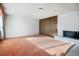 Spacious living room with brick fireplace, accent wall, and ample natural light streaming through the large window at 1716 Luning Dr, Las Vegas, NV 89106
