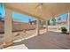 Backyard featuring covered patio, gravel, and block wall surround at 1826 Monte Alban Dr, North Las Vegas, NV 89031