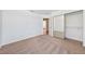 This bedroom features neutral carpet, white walls, and sliding door closet at 1826 Monte Alban Dr, North Las Vegas, NV 89031