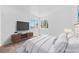 Bright bedroom featuring large windows and a TV at 1826 Monte Alban Dr, North Las Vegas, NV 89031