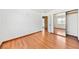 This bedroom features hardwood floors, white walls, and a mirrored closet at 1826 Monte Alban Dr, North Las Vegas, NV 89031