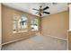 Sun-filled bedroom with neutral tones, carpeting, and scenic windows at 1826 Monte Alban Dr, North Las Vegas, NV 89031
