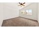 Empty bedroom showcasing carpeted floors, neutral walls, and two windows for natural light at 1826 Monte Alban Dr, North Las Vegas, NV 89031