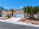 Charming one story home featuring a well-maintained front yard and a spacious two-car garage at 1826 Monte Alban Dr, North Las Vegas, NV 89031