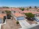 Charming two-story home featuring a well-maintained front yard and a spacious two-car garage at 1826 Monte Alban Dr, North Las Vegas, NV 89031
