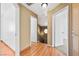 Hallway with hardwood floors and a decorative round window at 1826 Monte Alban Dr, North Las Vegas, NV 89031