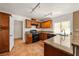 Kitchen features granite countertops, stainless steel appliances, wood cabinets, and tile floors at 1826 Monte Alban Dr, North Las Vegas, NV 89031