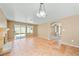 Open concept living area with sliding glass doors and an archway leading to another room at 1826 Monte Alban Dr, North Las Vegas, NV 89031