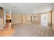 Spacious living area with tile and carpet flooring and neutral colored walls at 1826 Monte Alban Dr, North Las Vegas, NV 89031