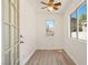 Bright office with laminate flooring, a ceiling fan, and multiple windows at 1826 Monte Alban Dr, North Las Vegas, NV 89031