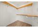 Walk-in closet featuring open shelving, and laminate flooring at 1826 Monte Alban Dr, North Las Vegas, NV 89031
