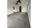 Large carpeted bedroom with an open doorway to another room at 1830 Justine Ct, Pahrump, NV 89048