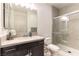 Bathroom with a modern vanity, sink, toilet, and sleek glass-enclosed shower at 211 E Kimberly Dr, Henderson, NV 89015