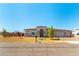 Charming single-story home with a well-maintained front yard and a three-car garage at 211 E Kimberly Dr, Henderson, NV 89015