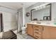 Bathroom featuring a shower-tub combo, double sink vanity, and neutral tones for a clean aesthetic at 2370 Via Firenze, Henderson, NV 89044