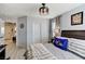 Bright bedroom with ample closet space and modern decor, seamlessly connecting to the hallway at 2370 Via Firenze, Henderson, NV 89044