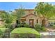 Charming two-story home featuring a stone facade, well-maintained landscaping, and inviting front porch at 2370 Via Firenze, Henderson, NV 89044