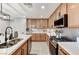 Well-equipped kitchen featuring modern appliances, stylish cabinetry, and sleek countertops at 2370 Via Firenze, Henderson, NV 89044