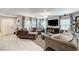 Cozy living room featuring ample seating, soft textures, natural light, and a sleek entertainment setup at 2370 Via Firenze, Henderson, NV 89044