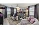 Elegantly decorated bedroom with large windows, plush bedding, and stylish floral wall art at 2370 Via Firenze, Henderson, NV 89044