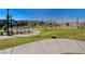 A community park features grass, walkways, and nearby residential area at 2370 Via Firenze, Henderson, NV 89044