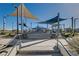 A community playground features sunshades, climbing structures, and modern landscaping at 2370 Via Firenze, Henderson, NV 89044