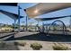 A playground offers sunshades, modern equipment, and a soft landing surface at 2370 Via Firenze, Henderson, NV 89044