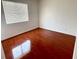 Bedroom with bright window and shiny wood floors at 2405 Prime Advantage Ave, North Las Vegas, NV 89032