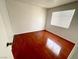 Bedroom with hardwood floor and a large window at 2405 Prime Advantage Ave, North Las Vegas, NV 89032
