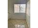 Bright dining area with tile floors and a large window, perfect for meals and gatherings at 2405 Prime Advantage Ave, North Las Vegas, NV 89032