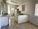 Bright kitchen featuring white cabinets, tile floors and a breakfast bar perfect for casual dining at 2405 Prime Advantage Ave, North Las Vegas, NV 89032