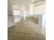 Bright living room with tile floors and large windows, offering a clean and modern feel at 2405 Prime Advantage Ave, North Las Vegas, NV 89032