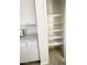 Pantry with plenty of shelves for storage with a view to the kitchen at 2405 Prime Advantage Ave, North Las Vegas, NV 89032