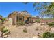 Exterior home view highlighting pergola covered patio, barbecue area, and mature landscaping at 2540 Binary Stars St, Henderson, NV 89044
