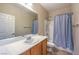Clean bathroom with a shower-tub combo and wooden vanity at 2540 Binary Stars St, Henderson, NV 89044